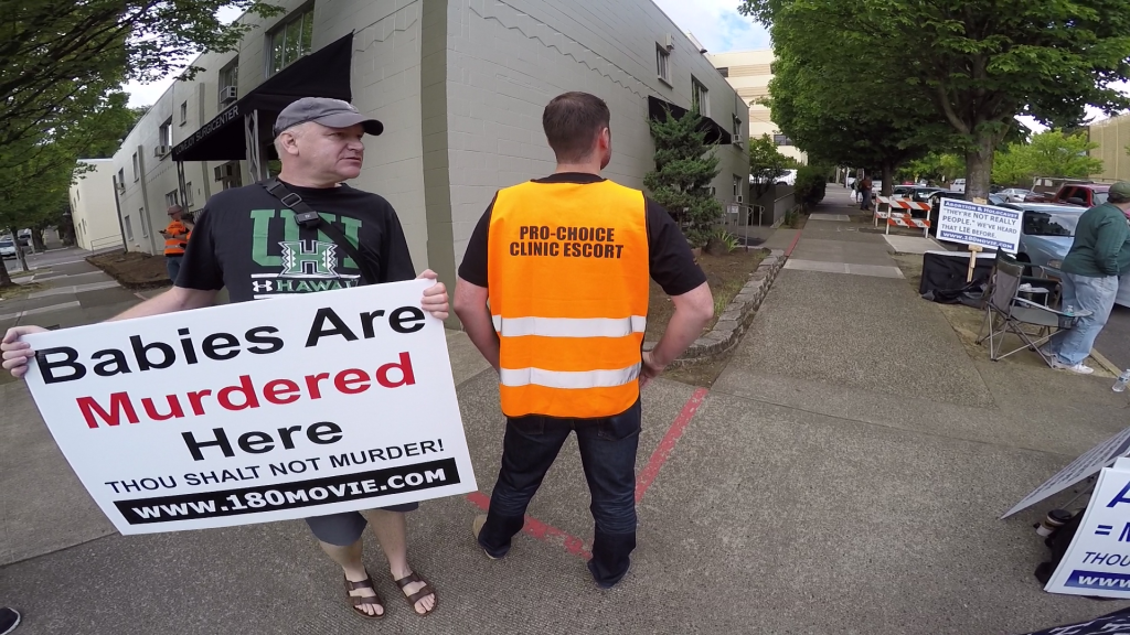 Sye Ten Bruggencate talking to "Jihadi Sean," a deathscort outside the Lovejoy Surgicenter Abortuary, in Portland, OR.
